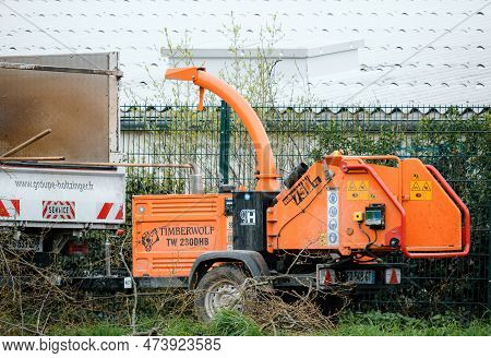 France - Mar 29, 2023: A Cityscape View Of A Working Timberwolf Tw 230dhb Wood Chipper Machine