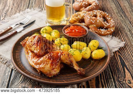 Oktoberfest Festival Food Half Fried Chicken With Boiled Potatoes, Sauce, Beer And Pretzels Close-up