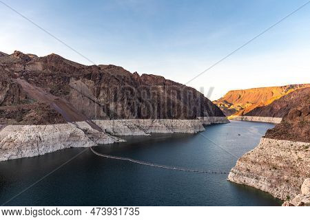 Hoover Dam Is A Concrete Arch-gravity Dam In The Black Canyon Of The Colorado River, On The Border B
