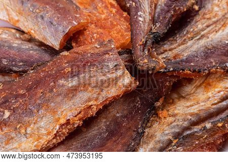 Pieces Of Cleaned Dried Fishbackground. Dry Peppered Pollack. Amber With Pepper Collection.