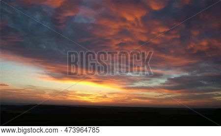 Sky Background With Fluffy Clouds. Realistic Dawn. Beautiful Purple Sky With Pink Clouds. Colorful 3