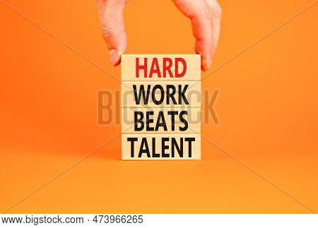 Hard Work Beats Talent Symbol. Concept Words Hard Work Beats Talent On Wooden Block. Beautiful Orang