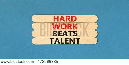 Hard Work Beats Talent Symbol. Concept Words Hard Work Beats Talent On Wooden Stick. Beautiful Blue 