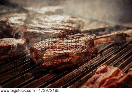 Some Excellent Pieces Of Argentinian Beef On A Charcoal Grill