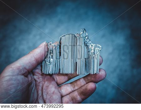 Man Is Holding Object Printed On Metal 3d Printer. Object Printed In Laser Sintering Machine. Modern