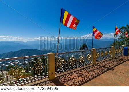 Colourful Buddhist Prayer Flags Are Waving In Strong Wind Under Sunshine At Samdruptse, Huge Buddhis