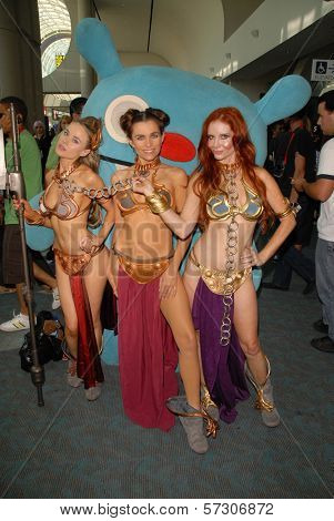 Paula Labaredas, Alicia Arden and Phoebe Price at the annual Slave Leia Group Photo at ComicCon, San Diego Convention Center, San Diego, CA. 07-23-10