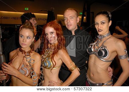 Paula Labaredas, Phoebe Price, Jamin Fite and Annisse annual Slave Leia Group Photo at ComicCon, San Diego Convention Center, San Diego, CA. 07-23-10
