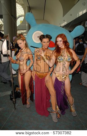 Paula Labaredas, Alicia Arden and Phoebe Price at the annual Slave Leia Group Photo at ComicCon, San Diego Convention Center, San Diego, CA. 07-23-10