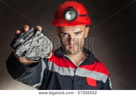 Coalminer Showing Lump Of Coal