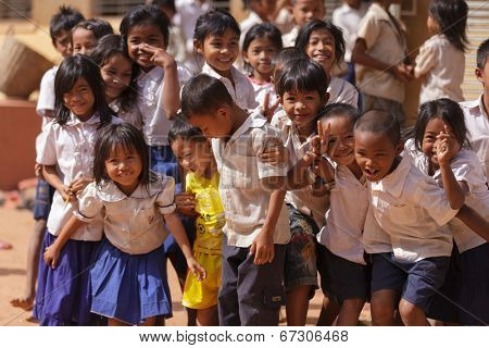 SIEM REAP, CAMBODIA, DECEMBER 04 : Cambodian students are posing in front of the school in a village near Siem Reap, Cambodia on December 04, 2012