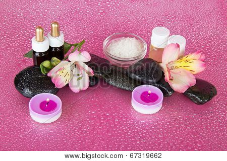 Aromatic oil, candles and stones