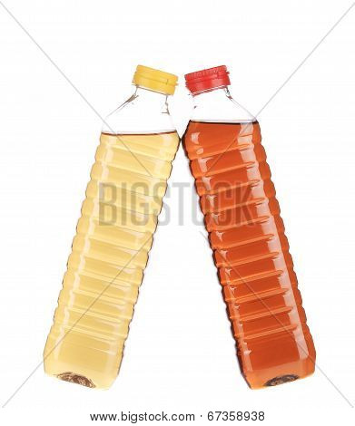 close up of bottles with apple and grape vinegar