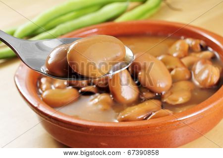 a traditional earthenware bowl with broad bean stew