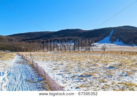 Skiing fields in West Virginia with picturesque background of trees and forestry hills.