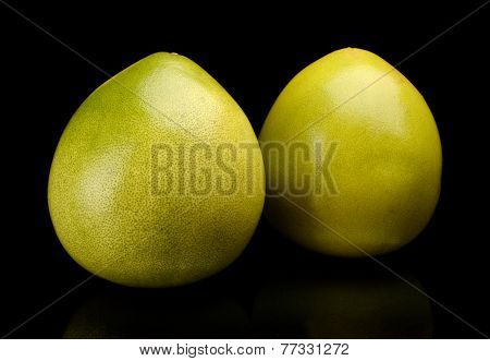 Two Pomelos Chinese Grapefruits Isolated On Black