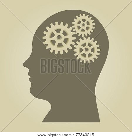 Human head silhouette with gears