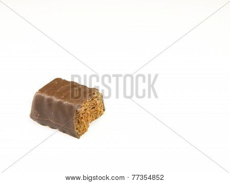 Bitten Chocolate Candy On A White Background.