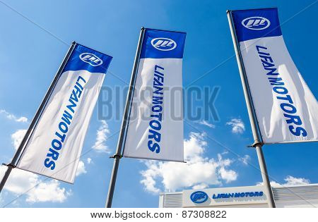 Flags Of Lifan Motors Over Blue Sky