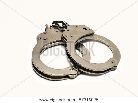 Steel Handcuffs On A White Background