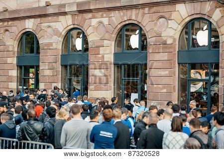 Customers Waiting In Front Of Apple Store