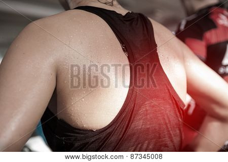 Detail Gym Shot - Sweat Skin Of A Woman's Back; Spinning, Aerobic Class