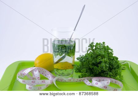Glass Of Lemon And Parsley On A Green Tray