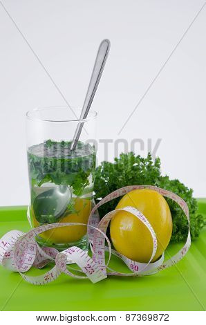 Glass Of Lemon And Parsley On A Green Tray
