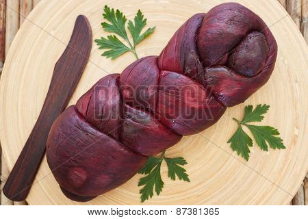 Treccia - Braided Mozzarella Bundle Marinated In Red Wine With Knife