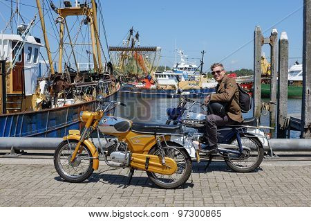Man sitting on a vintage Zundapp motorbike