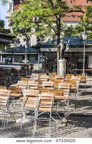 Munich, Germany - June 04, 2015: Outdoor seating area of a closed restaurant at the Viktualienmarkt