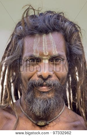 Sadhu, Holy Man Sits On The Ghat Along The Ganges River. Rishikesh, India