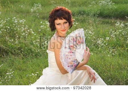 Young beautiful girl in a wedding dress