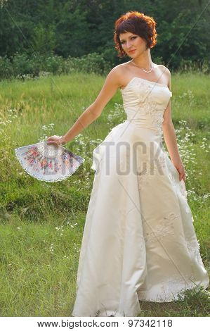 Young beautiful girl in a wedding dress