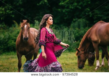 Beautiful gypsy in violet dress