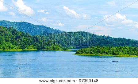 Beautiful Scene Blue Clear Water With Rock Mountain At Ratchaprapa Dam, Suratthani, Thailand