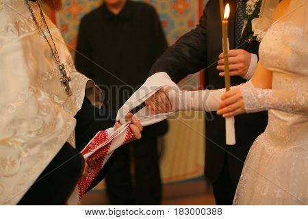The handfasting during the Orthodox church wedding