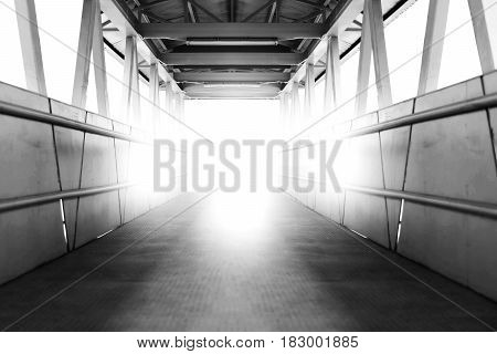 Desolate overpass walkway in Bangkok with light in white tone