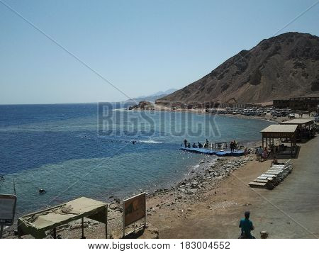Blue Seas surrounded by beautiful mountain and blue sky