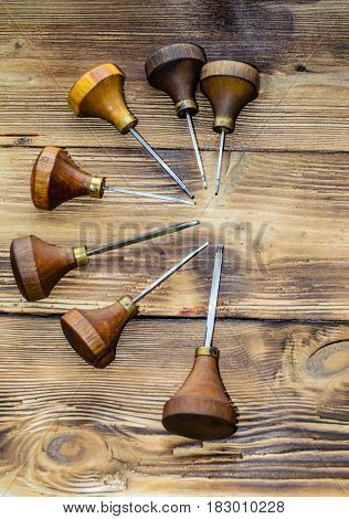 Different Gravers For Jewelry On Wooden Background