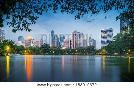 Bangkok Thailand - september 04 2016: evening scene of Bangkok skyline at Lumphini Park in Bangkok. Lumphini Park is a park in Bangkok