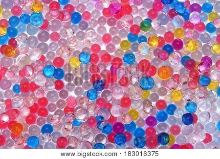 transparent colored water balls texture close up