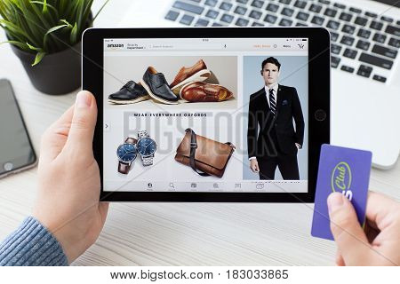 Alushta Russia - September 23 2016: Man holding a iPad Pro with Online shopping service Amazon on the screen. iPad Pro 9.7 Space Gray was created and developed by the Apple inc.