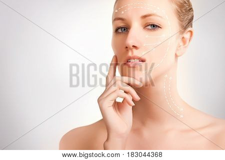 gorgeous blue eyed blonde model portrait with skin surgery mark isolated on white background