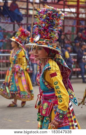 ORURO, BOLIVIA - FEBRUARY 26, 2017: Tinkus dancers in colourful costumes performing at the annual Oruro Carnival. The event is designated by UNESCO as being Intangible Cultural Heritage of Humanity.
