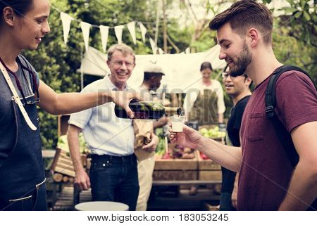 Group of men drinking local red wine together