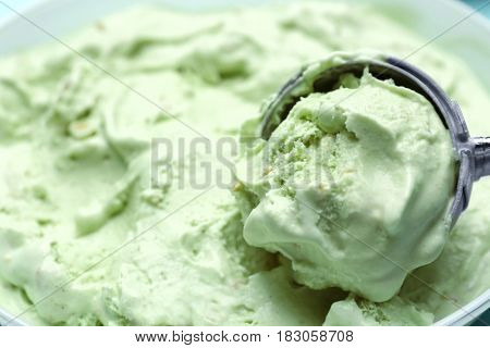 Scoop with delicious ice cream ball, closeup