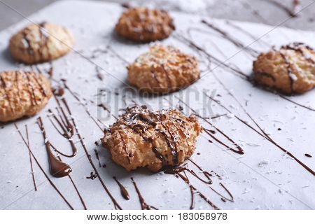 Delicious coconut macaroons on parchment paper