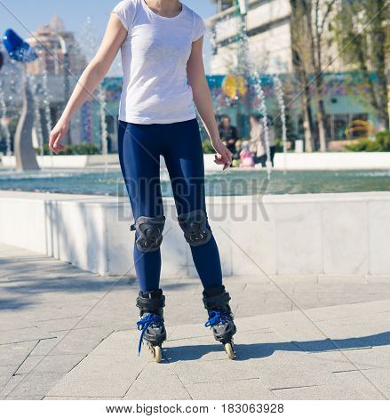 young Roller Girl is learning how to skate. First time on roller skates.