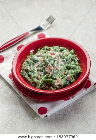 spatzli gnocchi with speck, selective focus 
